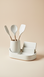 A centered image of a ceramic kitchen organizer from Urban Oasis, set against a light beige background. The product's...